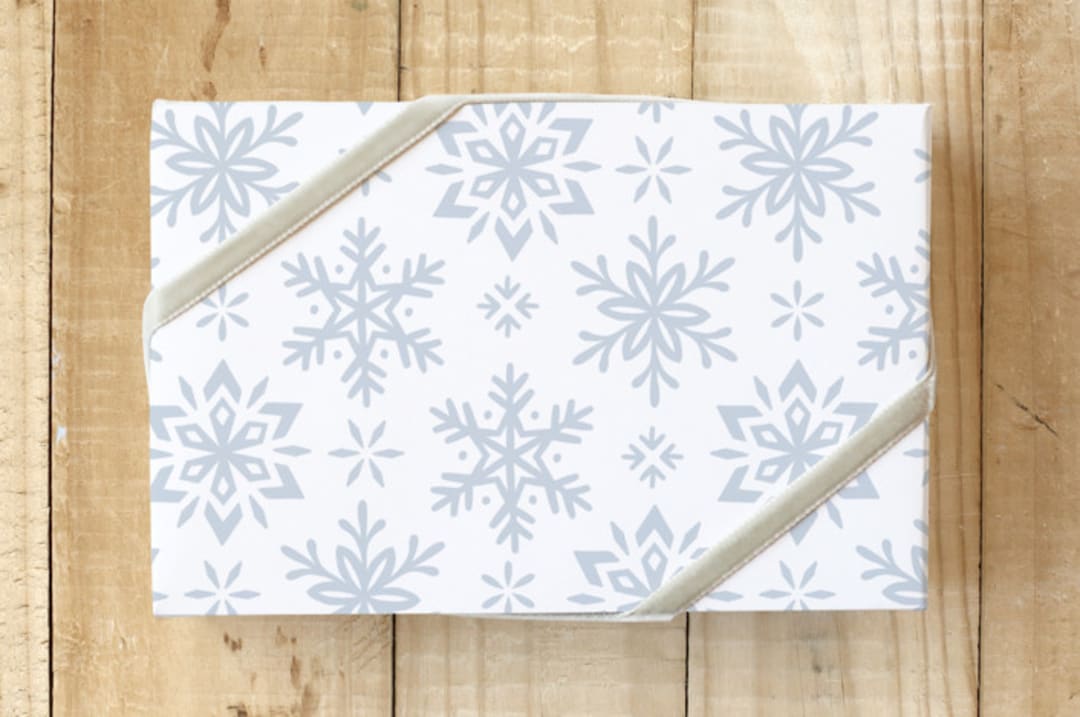 "Mixed Flurries" - Wrapping Paper in Snow by Rebecca Smith - Front