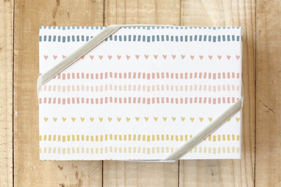 "Dashes and Hearts" - Wrapping Paper in Pastel Rainbow by Tina Faselli - Front