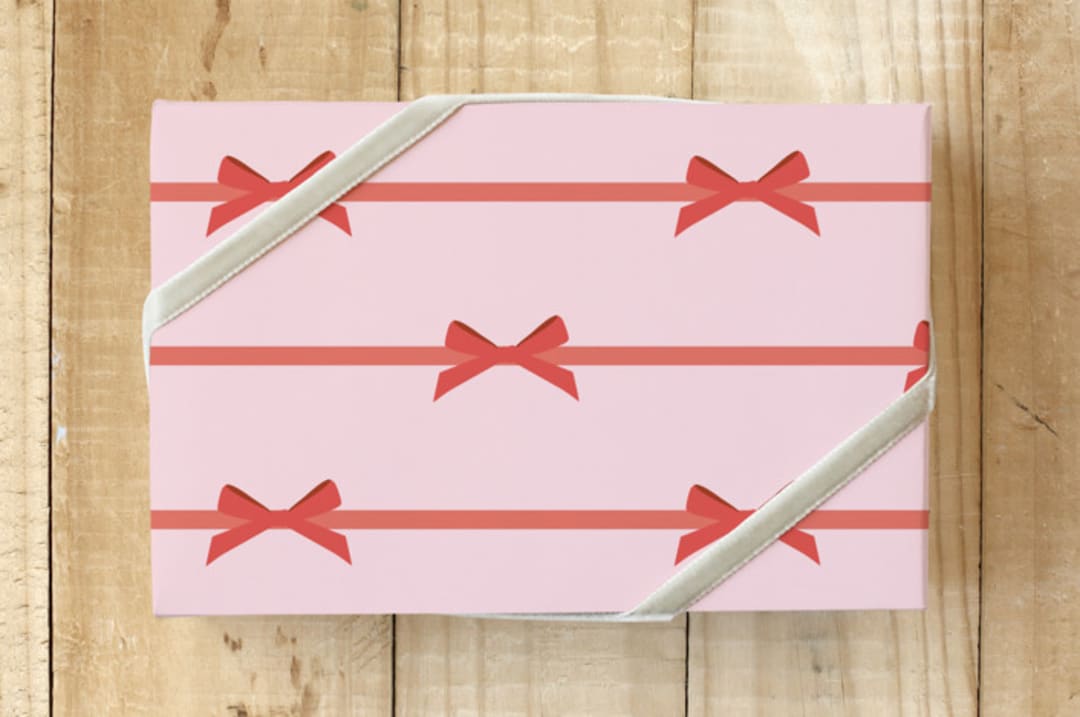 "Red Preppy Bows" - Wrapping Paper in Baby Pink by Emanuela Carratoni - Front