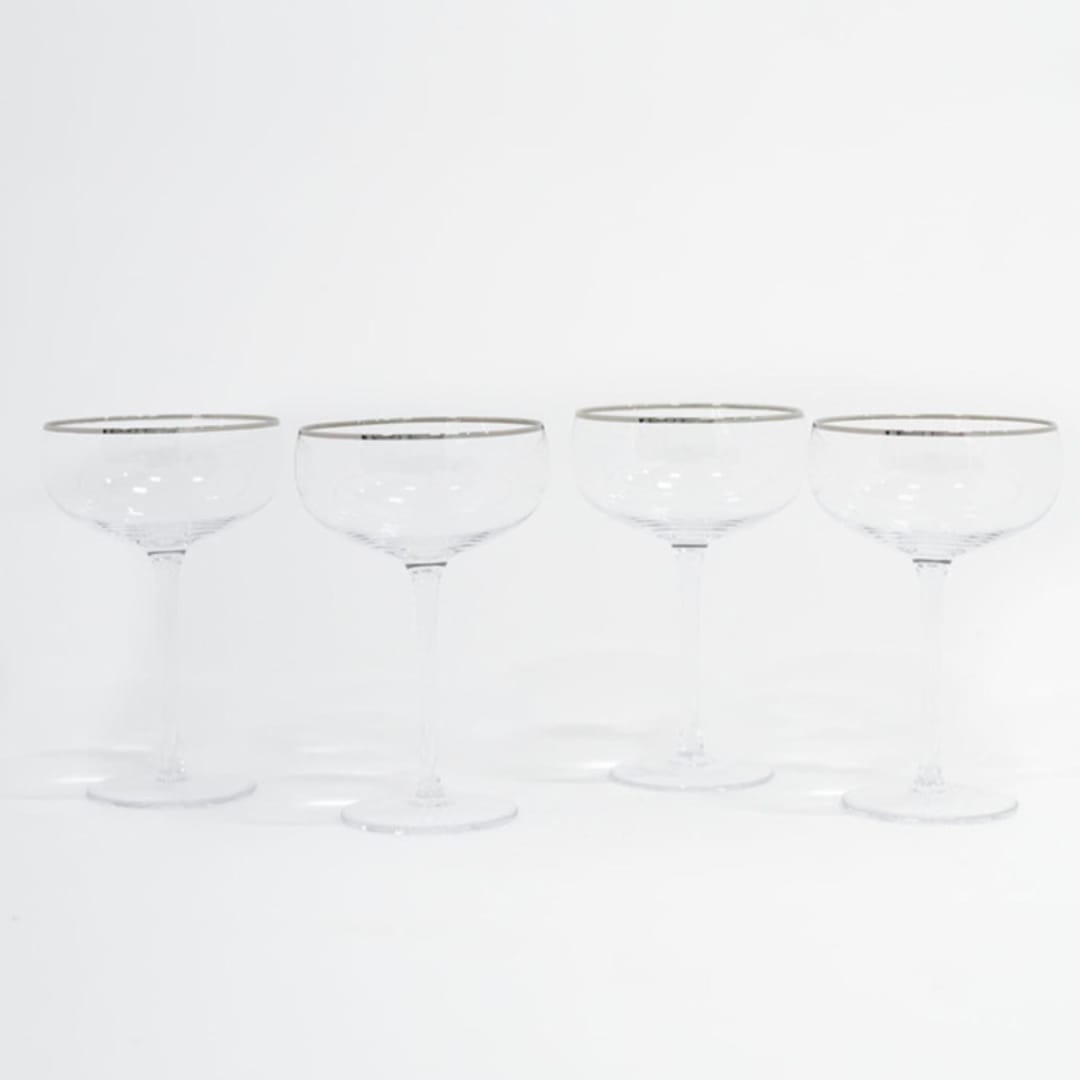 "SET OF 4 - SIREN STEMWARE // CHAMPAGNE COUPE IN CLEAR + PLATINUM" - Drinkware in clear by borrowed BLU