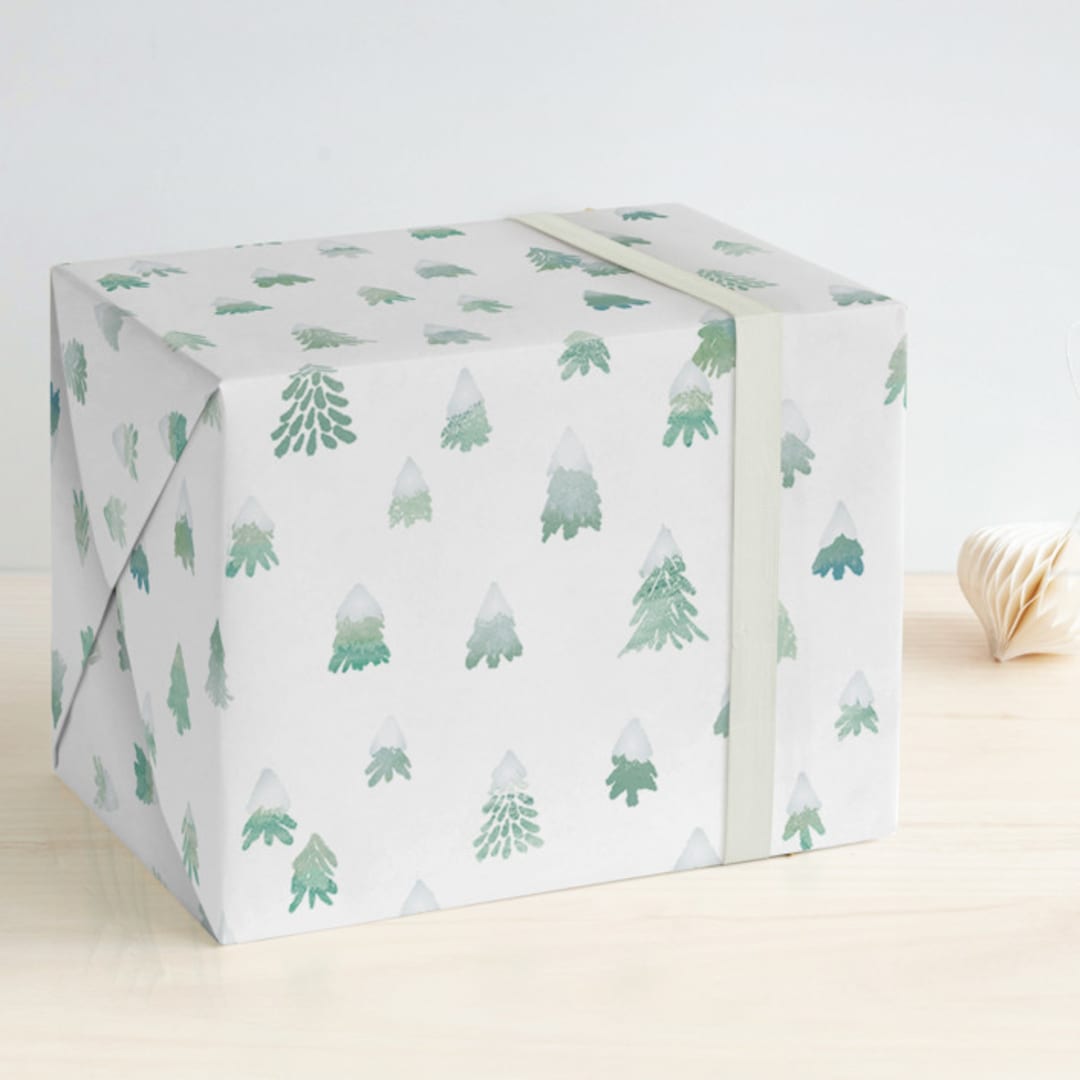 "Frosted Trees" - Wrapping Paper in Snow Caps by Hooray Creative - Front