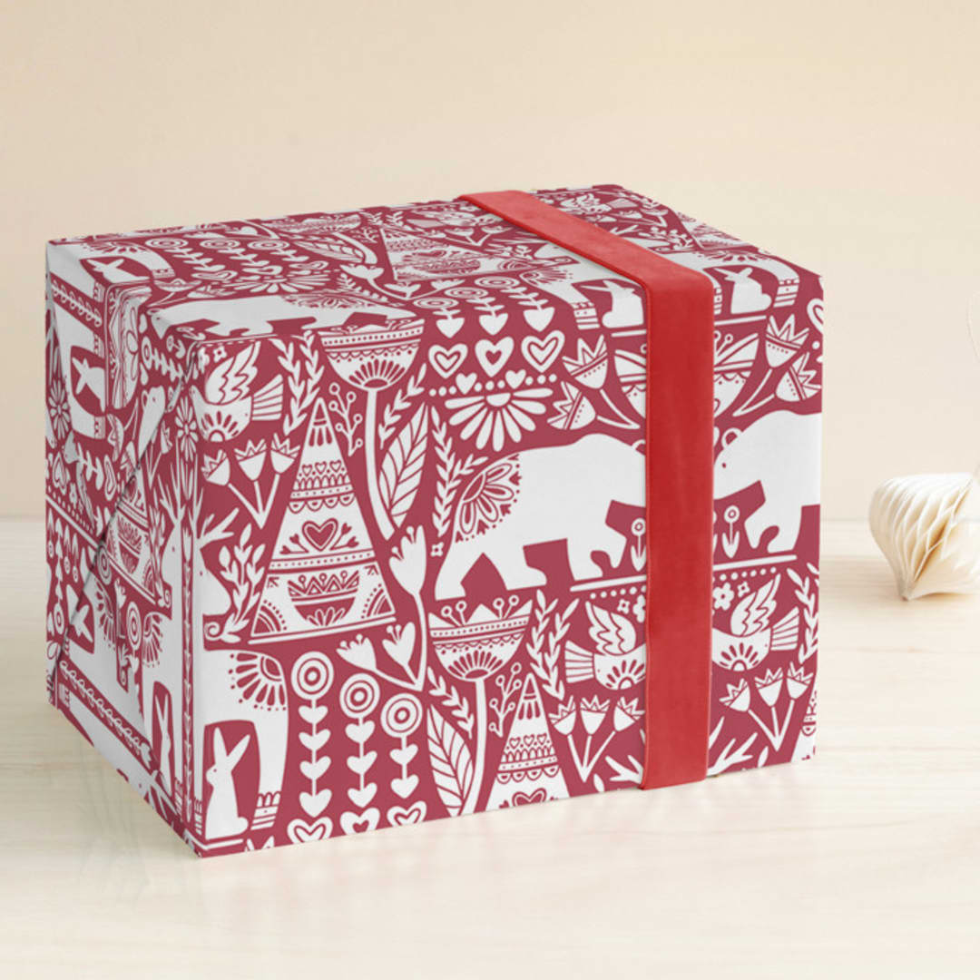 "Scandi Fauna" - Wrapping Paper in Holly Berry by Jessie Steury - Front