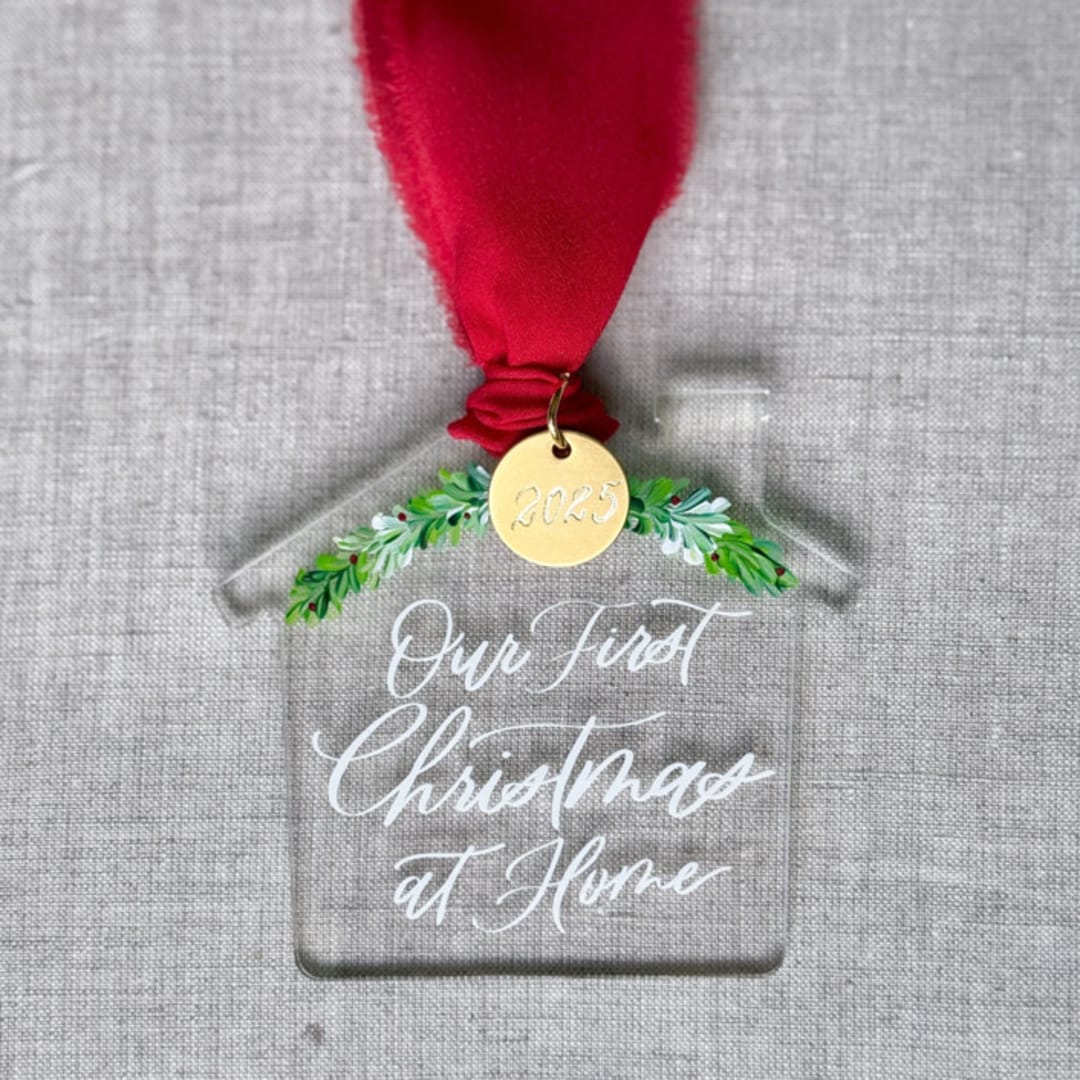 "First Christmas at Home - House Shaped Ornament" - Ornaments in clear by Maria Ferrer G.