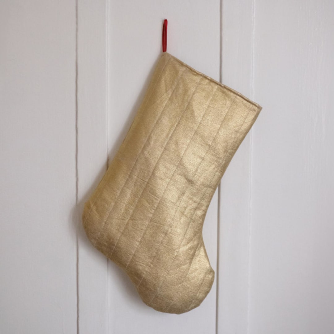 "Gold Quilted Stocking with Red Ribbon Hook Detail" - Stockings in gold by Quiet Goods