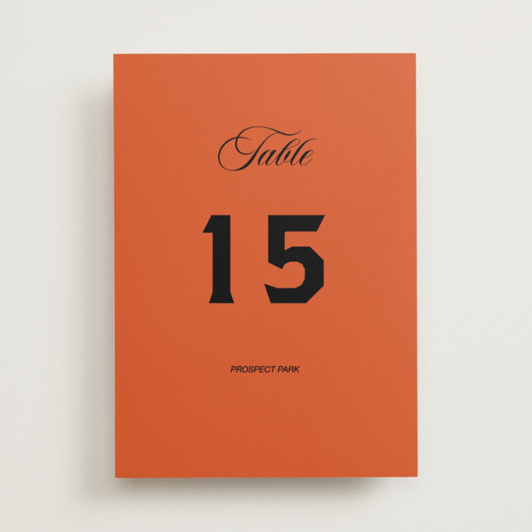 "Bold and Demure" - Table Numbers in Amaro by Claire - Front