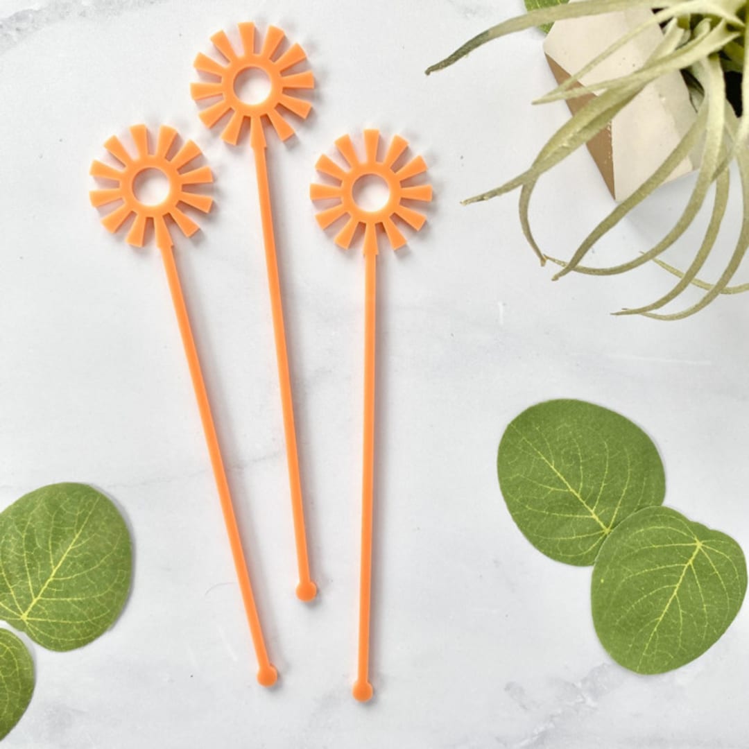 "Mid Mod Sun Stir Sticks - Coral (Set of 25)" - Stir Sticks in brown by Atomic Kraftworks