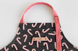 "Assorted Candy Canes" - Apron in Black by Hooray Creative - Detail