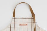 "Montauk" - Apron in Cocoa by Carolyn Nicks - Tag in Bodoni Regular