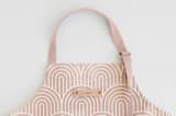 "Deco Arches" - Apron in Pink by Hooray Creative - Tag in Bodoni Regular