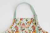 "Field of Florals" - Apron in Scarlet by Kelsey Carlson - Tag in Bodoni Regular