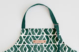 "Outdoors" - Apron in Forest by Luz Alliati - Tag in Bodoni Regular