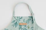"Botanical greenery" - Apron in Greenery by Lucrecia Caporale - Tag in Bodoni Regular
