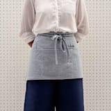 "Blue Waist Apron with Pockets" - Apron in blue by Powered By People