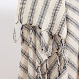 "Titus Santuklu Hand Towel" - Bath Towels in beige by Powered By People