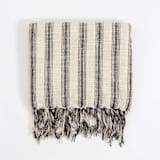 "Titus Santuklu Hand Towel" - Bath Towels in beige by Powered By People