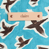 "Birds in Flight" - Carry-All Slouch Tote in Sky by Michelle Fifis - Tag Detail
