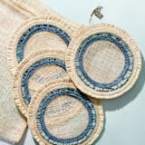 "Ruffle edge straw coasters, Indigo, set of four" - Coasters in blue by Joanna Buchanan
