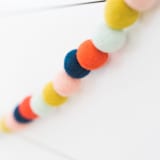 "Ticker Tape Felt Ball Garland" - Garlands in multicolor by aubry bennion