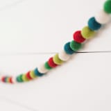 "Holly Berry Felt Ball Garland" - Garlands in multicolor by aubry bennion