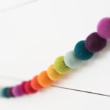 "Pigment Felt Ball Garland" - Garlands in multicolor by aubry bennion