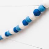 "Festival of Lights Felt Ball Garland" - Garlands in multicolor by aubry bennion