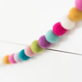 "Seamstress Felt Ball Garland" - Garlands in multicolor by aubry bennion