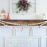 "Gnomes Garland, White + Red, (6 feet)" - Garlands in white by Nivas Collection