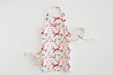 "Jumping Reindeer" - Personalizable Children's Apron in Red by Phrosné Barwood - Personalizable Apron