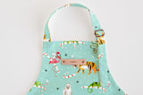 "Wild and Sweet Christmas" - Personalizable Children's Apron in Frozen Pond by Michelle Shanaman - Tag in Bodoni Regular