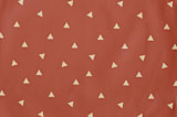 "Golden Triangle" - Personalizable Children's Apron in Rust by Cindy Lackey - Fabric Detail