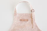 "Deco Arches" - Personalizable Children's Apron in Pink by Hooray Creative - Tag in Bodoni Regular