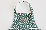 "Outdoors" - Personalizable Children's Apron in Forest by Luz Alliati - Tag in Bodoni Regular