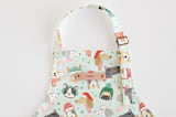 "Christmas Puppies" - Personalizable Children's Apron in Mint by Monika Torun - Tag in Bodoni Regular