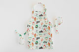 "Christmas Puppies" - Personalizable Children's Apron in Mint by Monika Torun - Apron without personalization