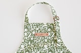 "A Baker's Holiday" - Personalizable Children's Apron in Sage by Jaclyn Ruble - Tag in Bodoni Regular