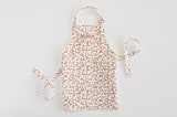 "Enchanted Holiday" - Personalizable Children's Apron in Cinnamon by Teju Reval - Personalizable Apron