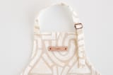"Antique" - Personalizable Children's Apron in Sand by Iveta Angelova - Tag in Bodoni Regular