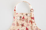 "Retro Ornaments" - Personalizable Children's Apron in Coral by Vivian Yiwing - Tag in Bodoni Regular
