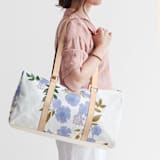 "Botanical Cascade - Peri" - Fillmore Duffle in Periwinkle by Erin German - On Model