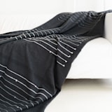"Alei Throw" - Blankets and Throws in black by Anjali Purohit
