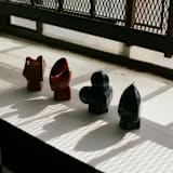"Puppets & Puppets and Hands Suit Suite WITHOUT CERAMIC TRAY" - Candles and Holders in red by Danielle Gaito
