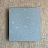"Steel blue baby ribbon bows envelope liner for A7 square flap envelope | pack of 10" - Envelope Liners in blue by Ivory Invitations