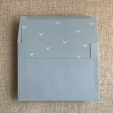 "Steel blue baby ribbon bows envelope liner for A7 square flap envelope | pack of 10" - Envelope Liners in blue by Ivory Invitations