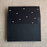 "Black baby ribbon bows envelope liner for A7 square envelope | pack of 10" - Envelope Liners in black by Ivory Invitations