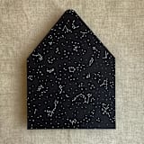 "white ink print Stella Celestial printed black envelope liner for A7 euro flap envelope | pack of 10" - Envelope Liners in black by Ivory Invitations