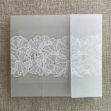 "White ink print Ruffled floral lace ribbon printed vellum wrap for 5x7 card | pack of 10" - Invitation Jackets and Overlays in white by Ivory Invitations