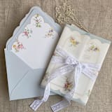 "Clara pale blue scallop floral edge printed vellum wrap for 5x7 card | pack of 10" - Invitation Jackets and Overlays in blue by Ivory Invitations