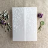 "White ink print Willow leaves and rose flower canopy printed vellum wrap for 5x7 card | pack of 10" - Invitation Jackets and Overlays in white by Ivory Invitations