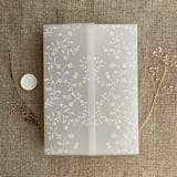 "White ink print dainty floral vines printed vellum wrap for 5x7 card  | pack of 10" - Invitation Jackets and Overlays in white by Ivory Invitations