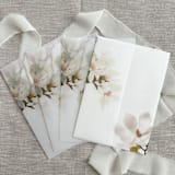 "Magnolia vellum jackets for invitations | Set of 10" - Invitation Jackets and Overlays in white by Maria Ferrer G.